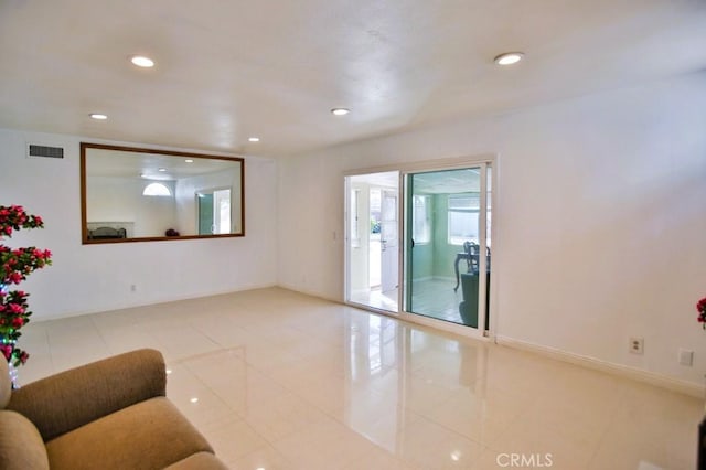 empty room with recessed lighting, visible vents, baseboards, and light tile patterned floors