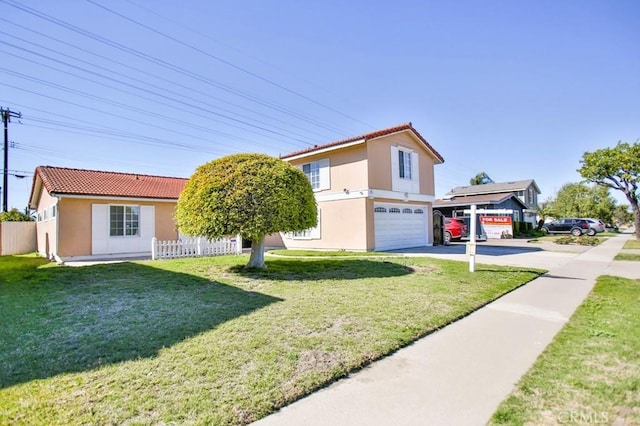 view of front of home featuring a garage, a front yard, fence, and driveway