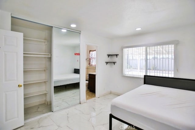 bedroom with marble finish floor, baseboards, and recessed lighting