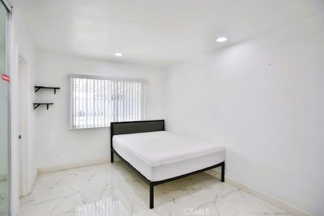 bedroom with marble finish floor, baseboards, and recessed lighting