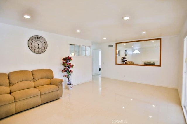 living area with visible vents and recessed lighting