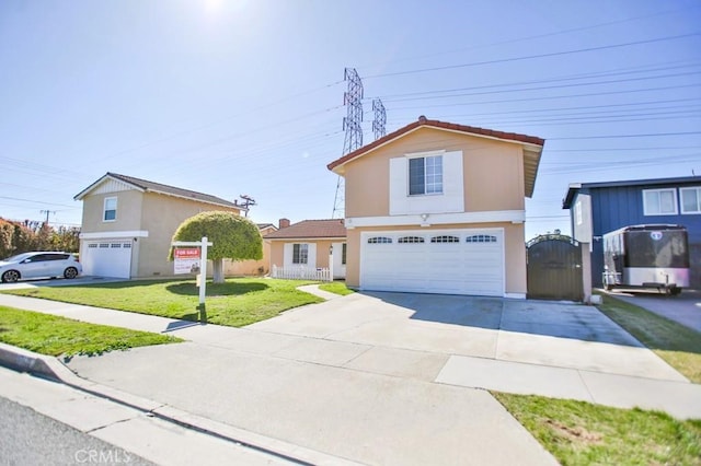 traditional home with stucco siding, an attached garage, a gate, driveway, and a front lawn