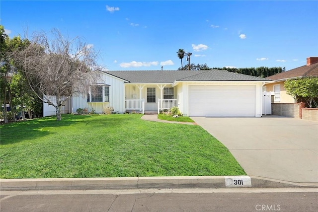 ranch-style house with a porch, an attached garage, a front lawn, concrete driveway, and board and batten siding