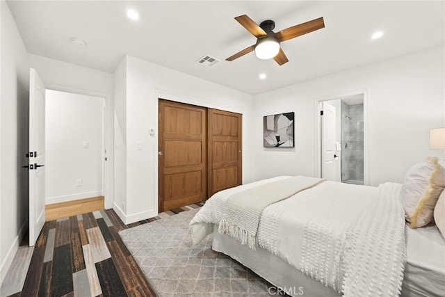 bedroom with visible vents, wood finished floors, recessed lighting, a closet, and baseboards