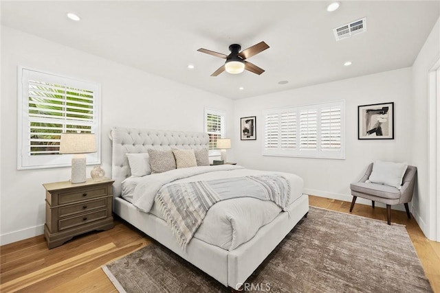 bedroom with visible vents, baseboards, ceiling fan, light wood-type flooring, and recessed lighting