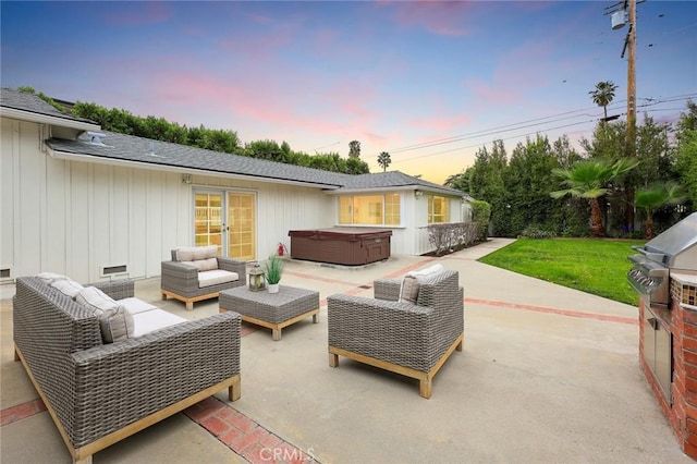 view of patio / terrace with an outdoor hangout area, french doors, and a hot tub