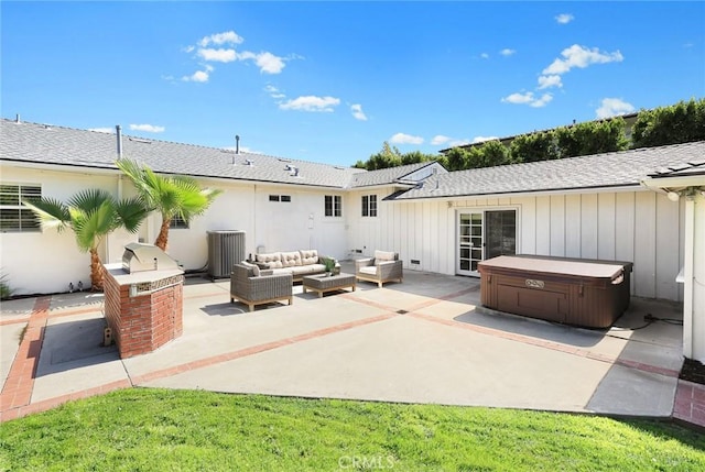 rear view of property featuring central AC, a hot tub, board and batten siding, outdoor lounge area, and a patio area