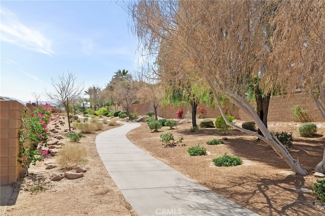 view of community featuring fence