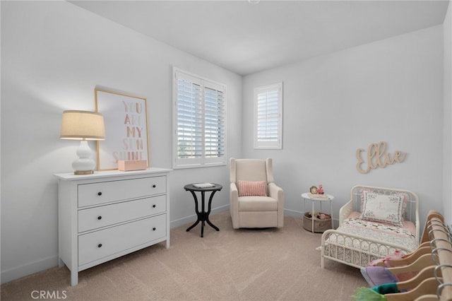 sitting room with light colored carpet and baseboards