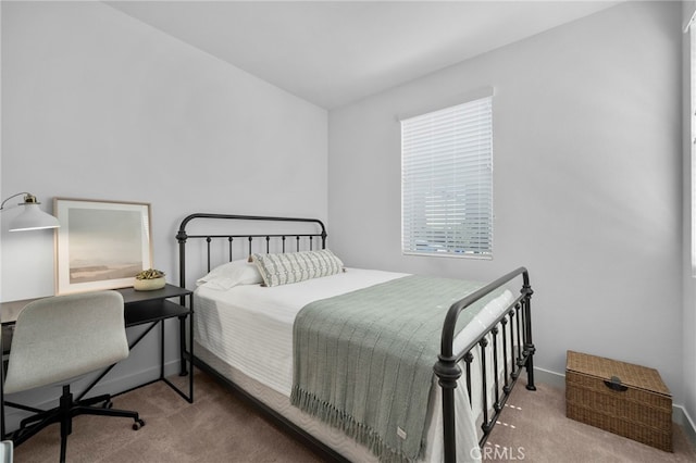 carpeted bedroom with baseboards