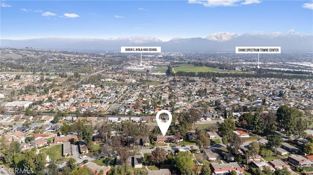 drone / aerial view featuring a mountain view