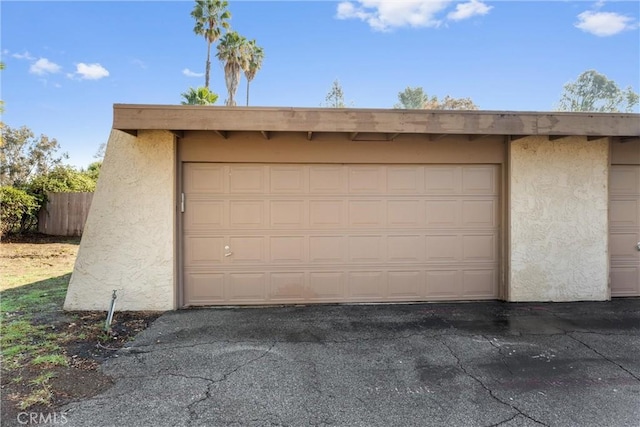 garage with fence