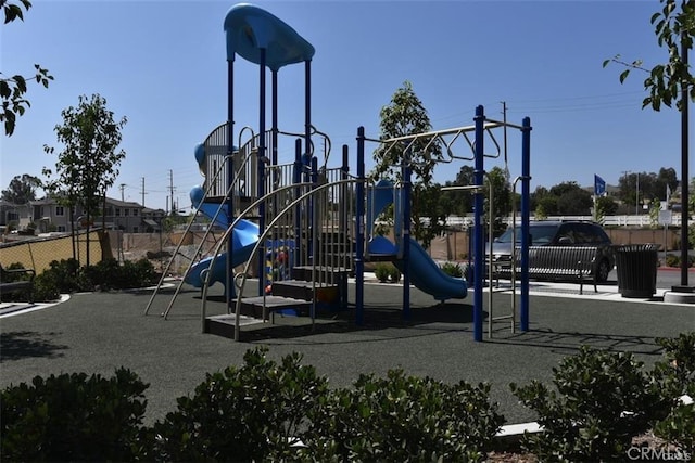 communal playground featuring fence