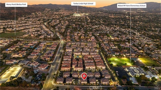 birds eye view of property featuring a mountain view