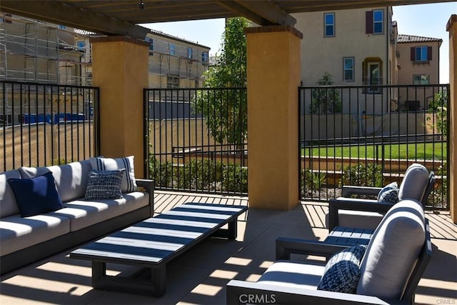 view of patio / terrace with outdoor lounge area and fence