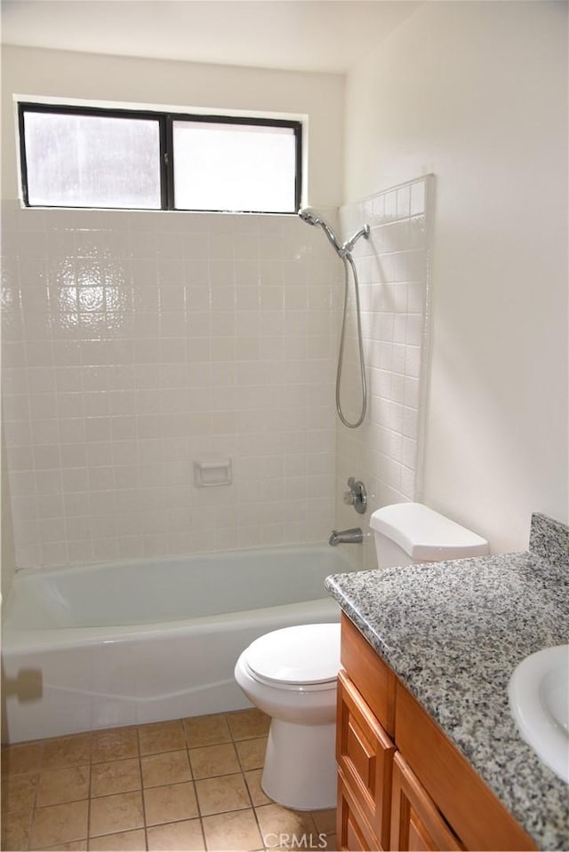 bathroom featuring vanity,  shower combination, toilet, and tile patterned floors