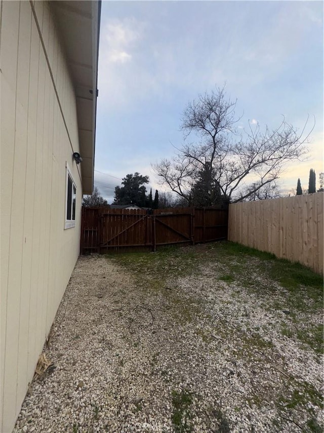 view of yard featuring a gate and fence