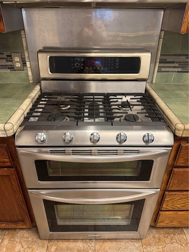 details with range with two ovens and backsplash