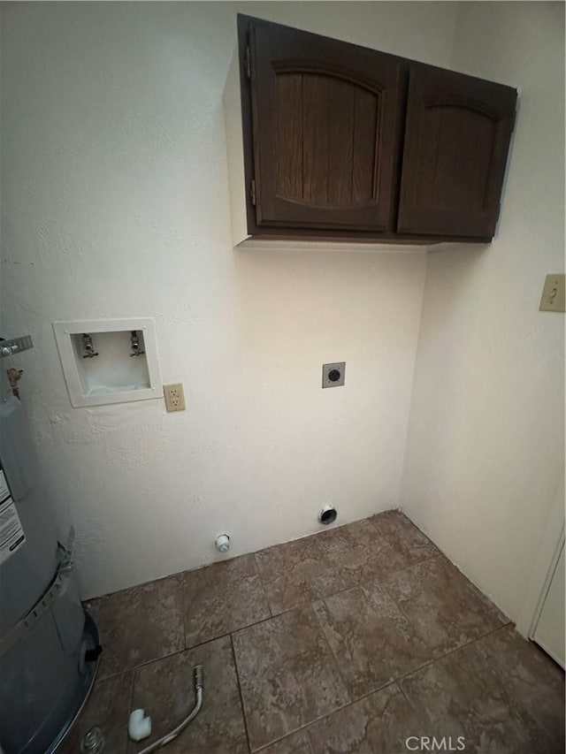 clothes washing area featuring cabinet space and washer hookup