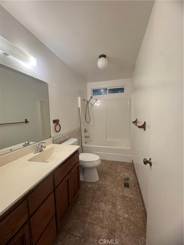 bathroom with visible vents, shower / bathing tub combination, vanity, and toilet