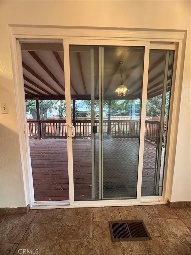 entryway with baseboards and visible vents