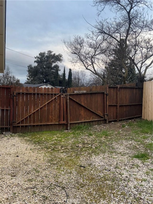 view of yard featuring a gate and fence