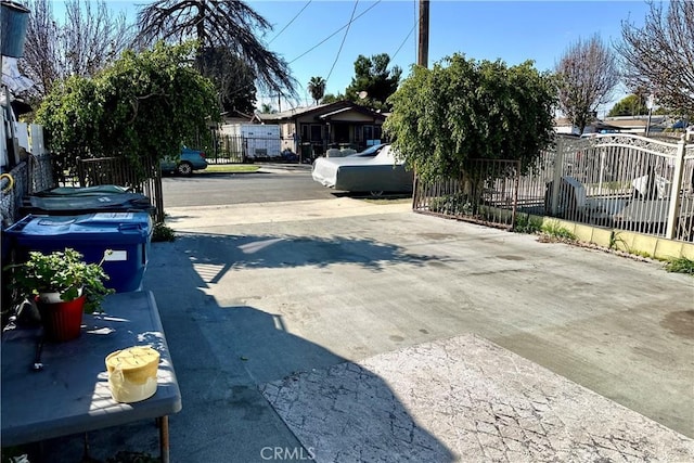 view of street with concrete driveway