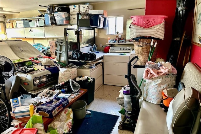 interior space featuring washer / clothes dryer and speckled floor