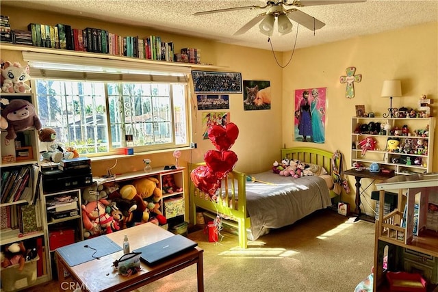 carpeted bedroom featuring ceiling fan and a textured ceiling