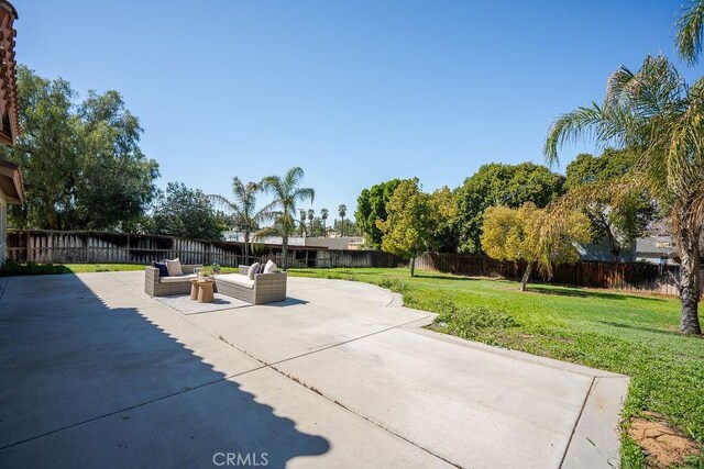 view of patio featuring a fenced backyard and an outdoor hangout area