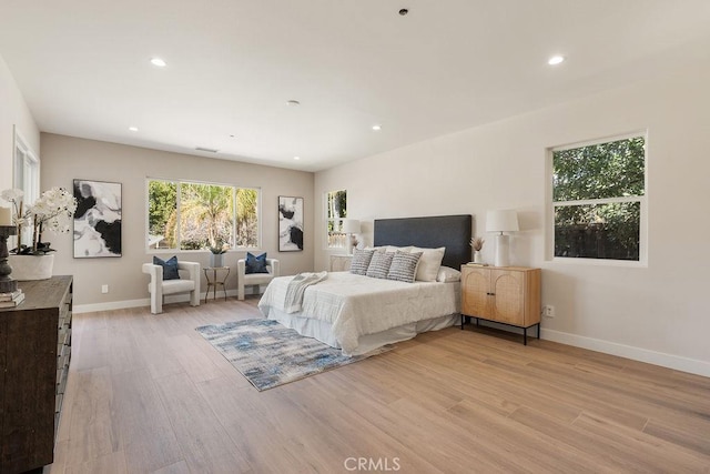 bedroom featuring light wood-style flooring, recessed lighting, and baseboards