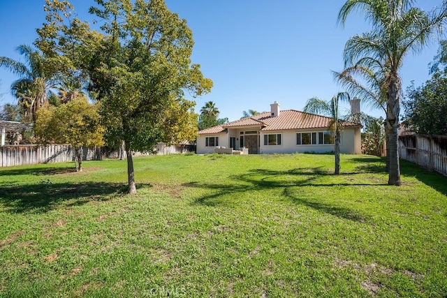 view of yard featuring a fenced backyard