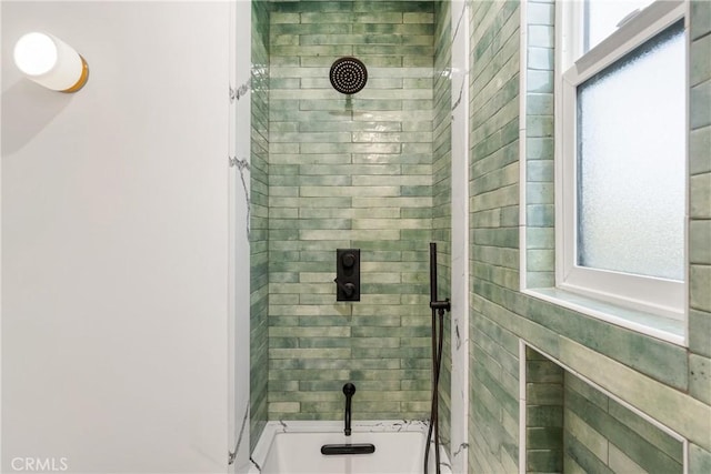 bathroom with a tile shower