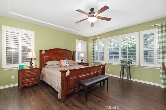 bedroom featuring dark wood-style floors, baseboards, and a ceiling fan