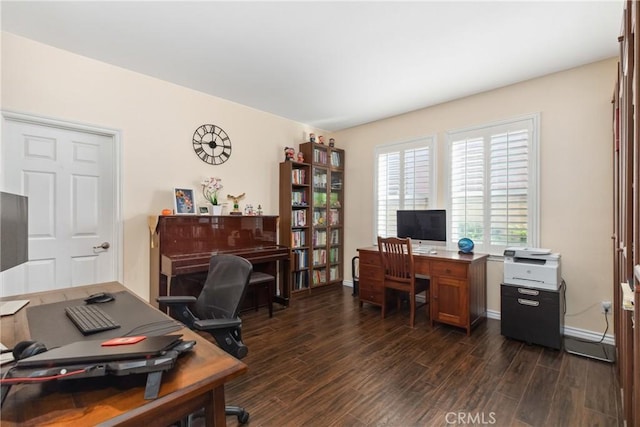 office area with dark wood-type flooring and baseboards