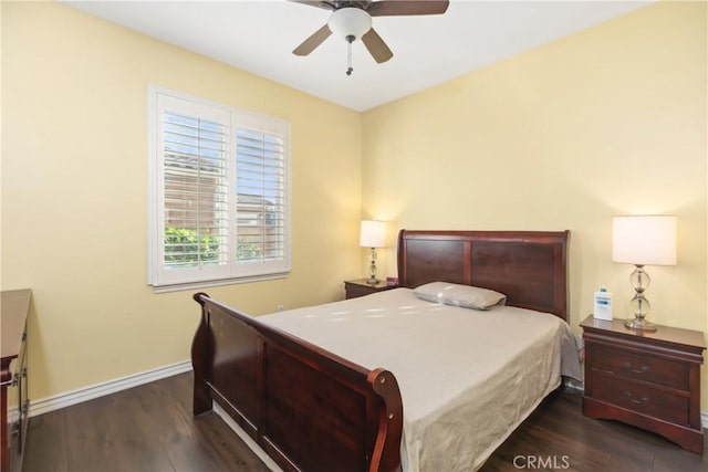 bedroom featuring ceiling fan, wood finished floors, and baseboards