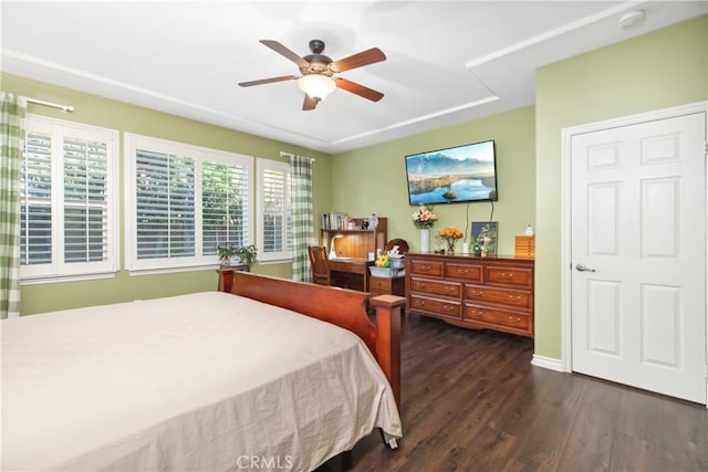 bedroom with dark wood finished floors and a ceiling fan