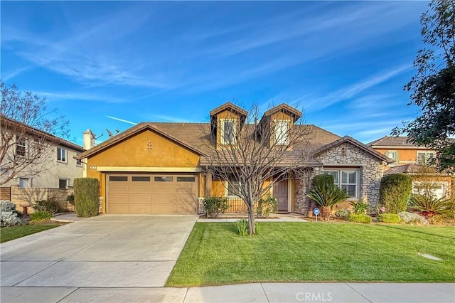 view of front of property featuring a garage, stone siding, a front lawn, and concrete driveway