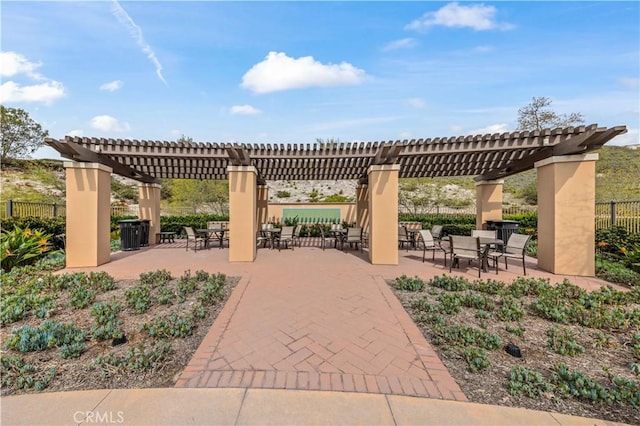 view of patio / terrace featuring fence and a pergola