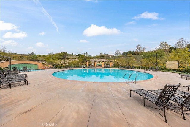 community pool with a patio area