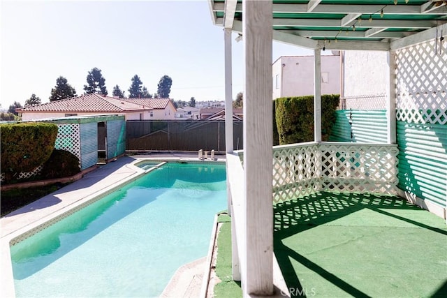 view of swimming pool with a fenced backyard and a fenced in pool