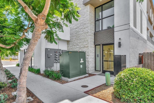 property entrance featuring stucco siding