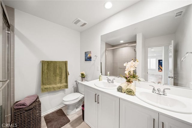 full bathroom with a shower stall, visible vents, and a sink