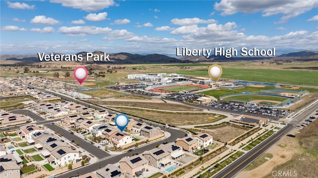 birds eye view of property featuring a mountain view