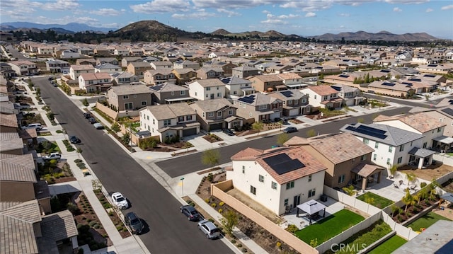 drone / aerial view featuring a residential view and a mountain view