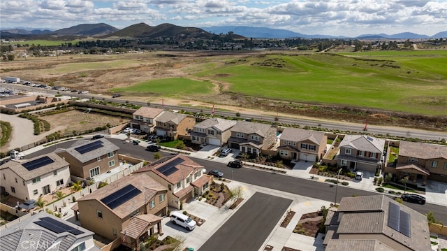 birds eye view of property with a residential view and a mountain view