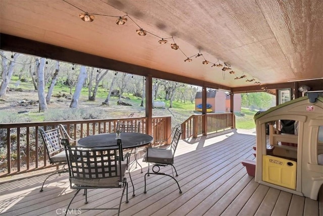 deck featuring outdoor dining area