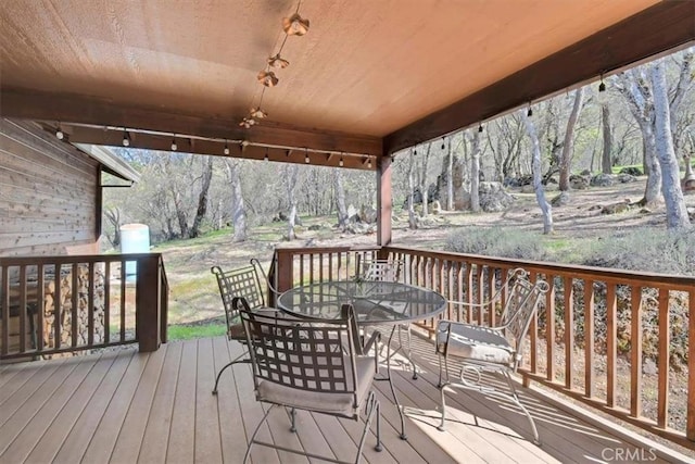wooden deck with outdoor dining area