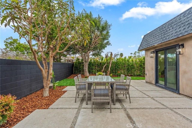 view of patio / terrace featuring a fenced backyard and outdoor dining space