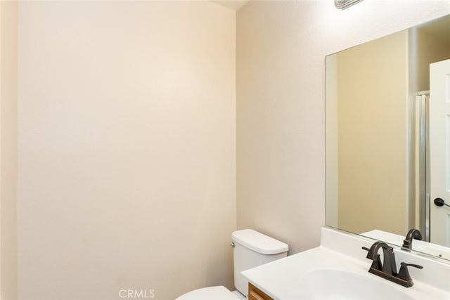 half bath with vanity and toilet